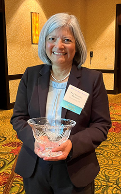 Professor Thronson with her "Champion of Justice Award"